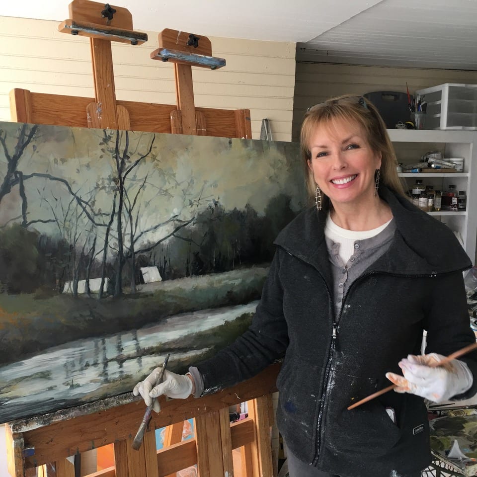 Rachael painting an art